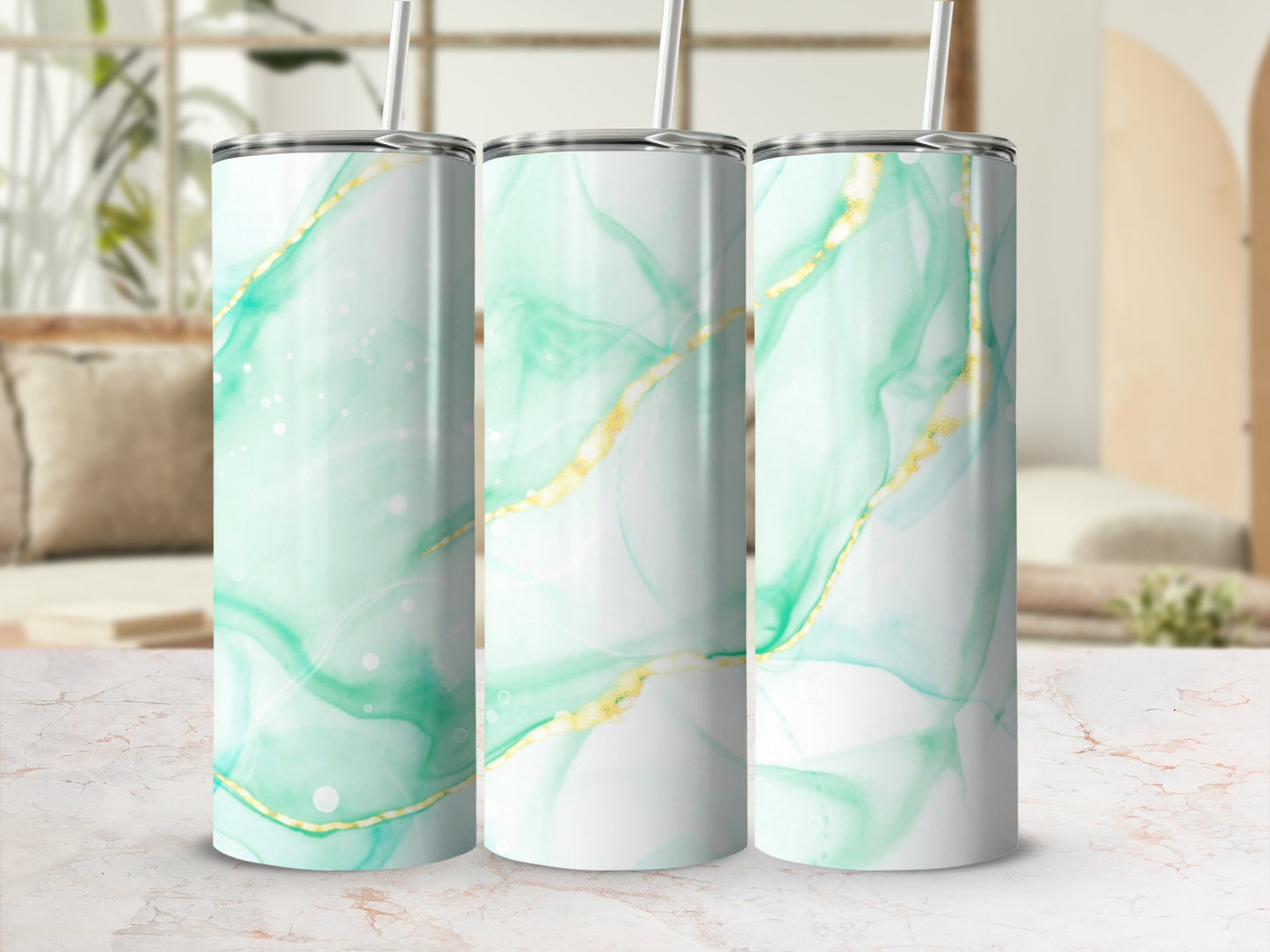 Three tumblers with a marbled green and gold abstract design.