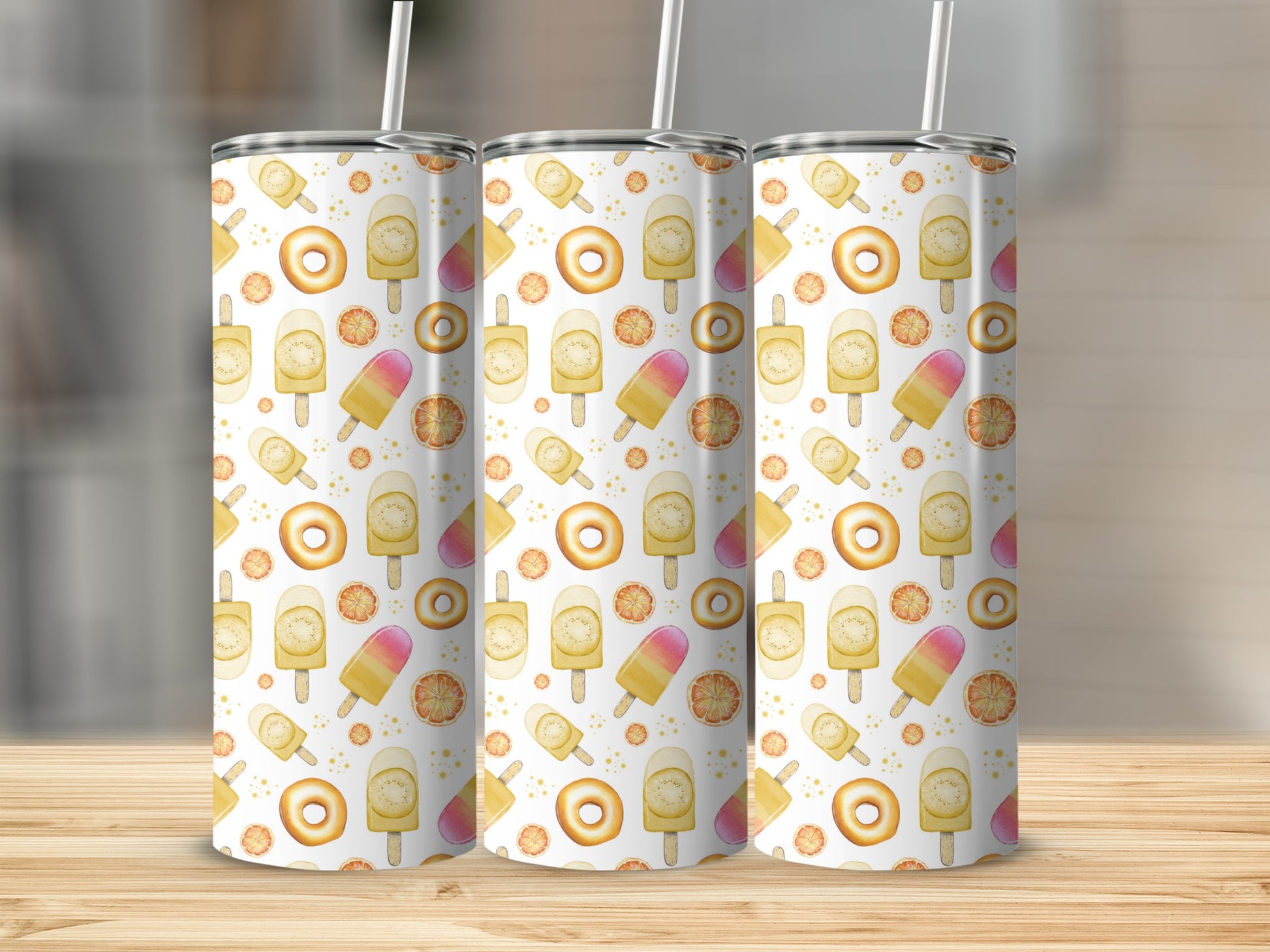 Three tumblers with orange slice and popsicle pattern.