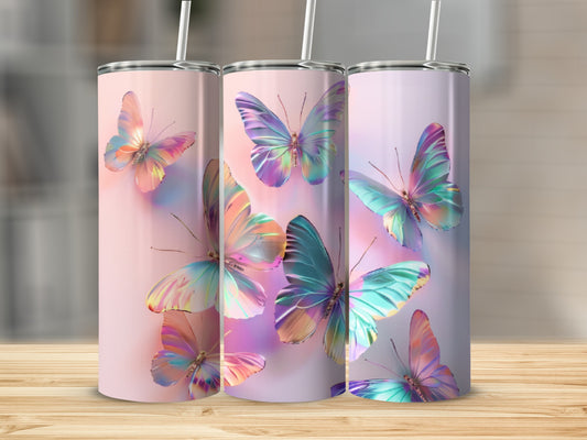 Three iridescent butterflies on pastel gradient tumblers with straws.