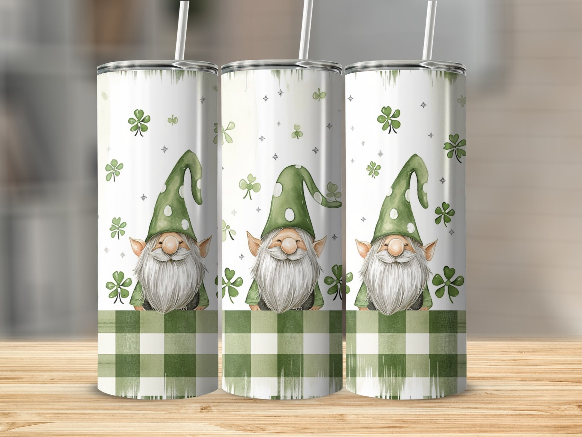 Three tumblers with St. Patrick's Day gnomes and shamrocks on a checkered background.