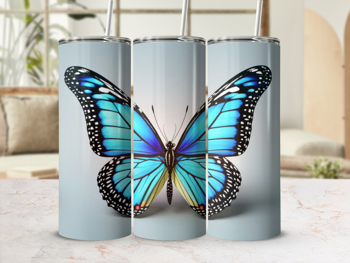 Blue and black butterfly design on a tall, cylindrical tumbler.