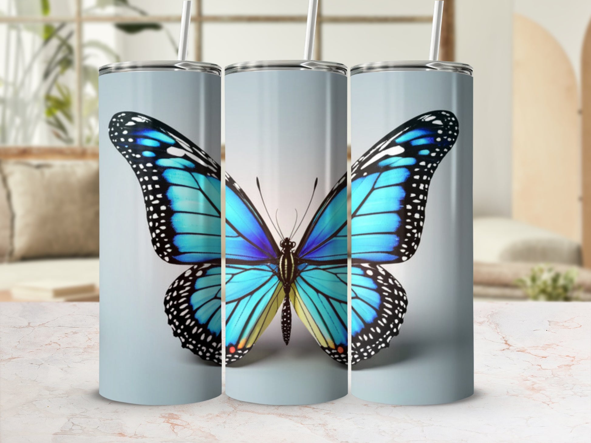Blue and black butterfly design on a tall, cylindrical tumbler.