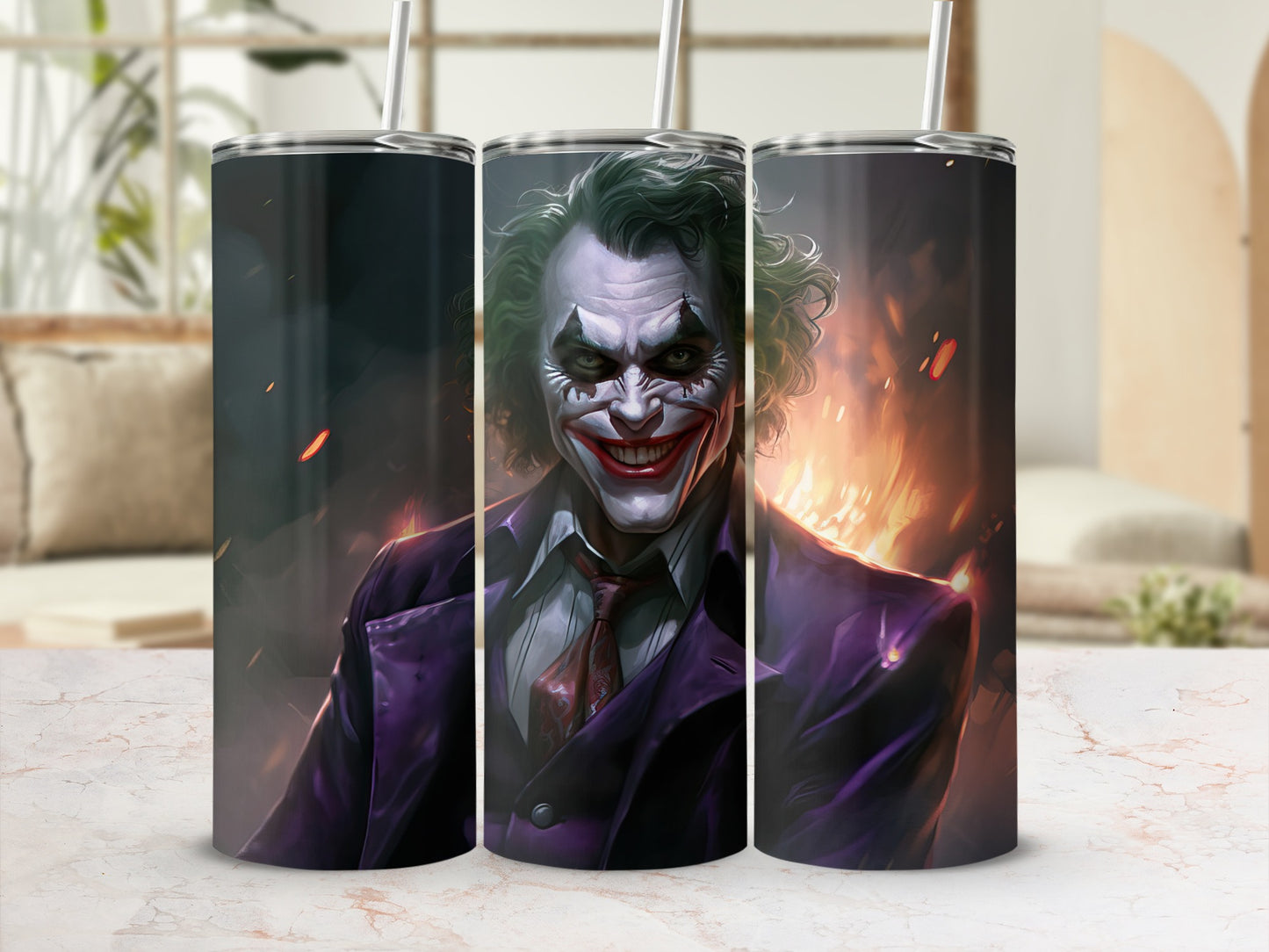 Three tumblers featuring a close-up of the Joker in a purple suit with a fiery background.