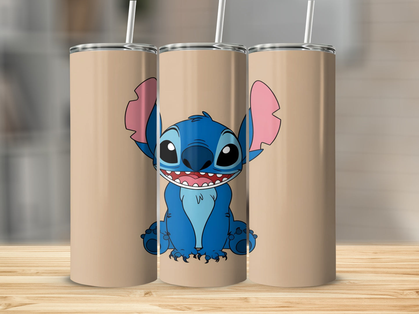Three tan tumblers with Stitch character art.