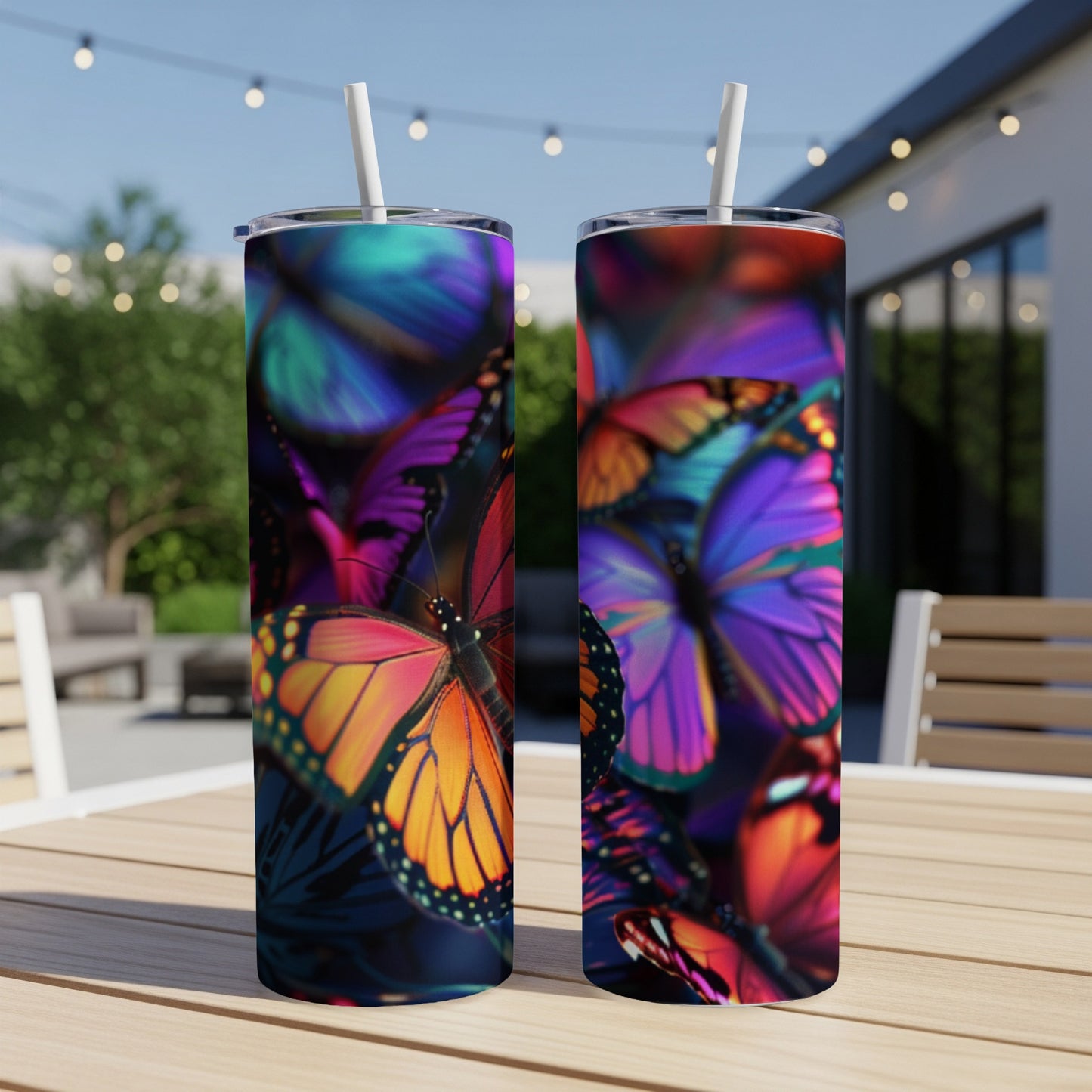 Two tumblers with a vibrant, close-up butterfly pattern.