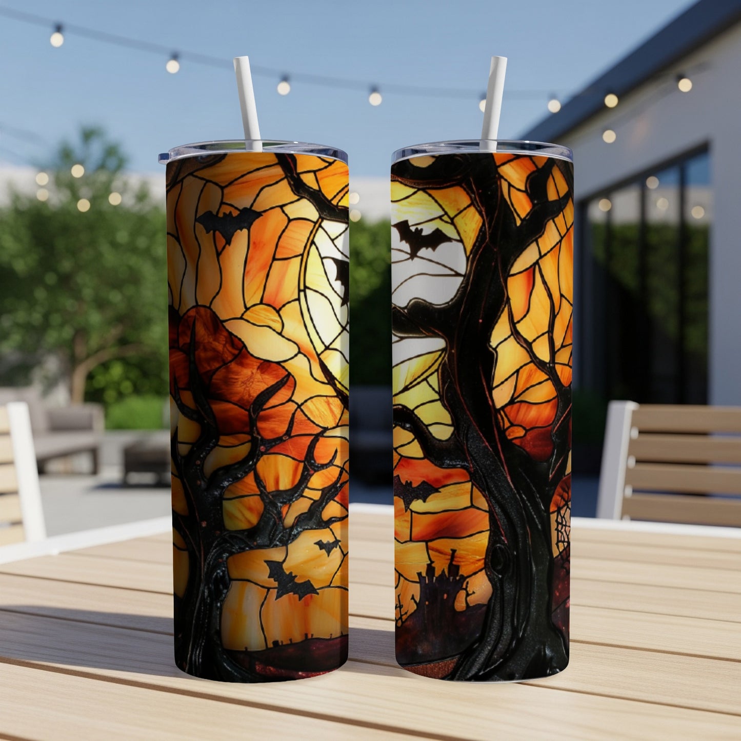 Two tumblers with Halloween stained glass design of bats, trees, and a castle.