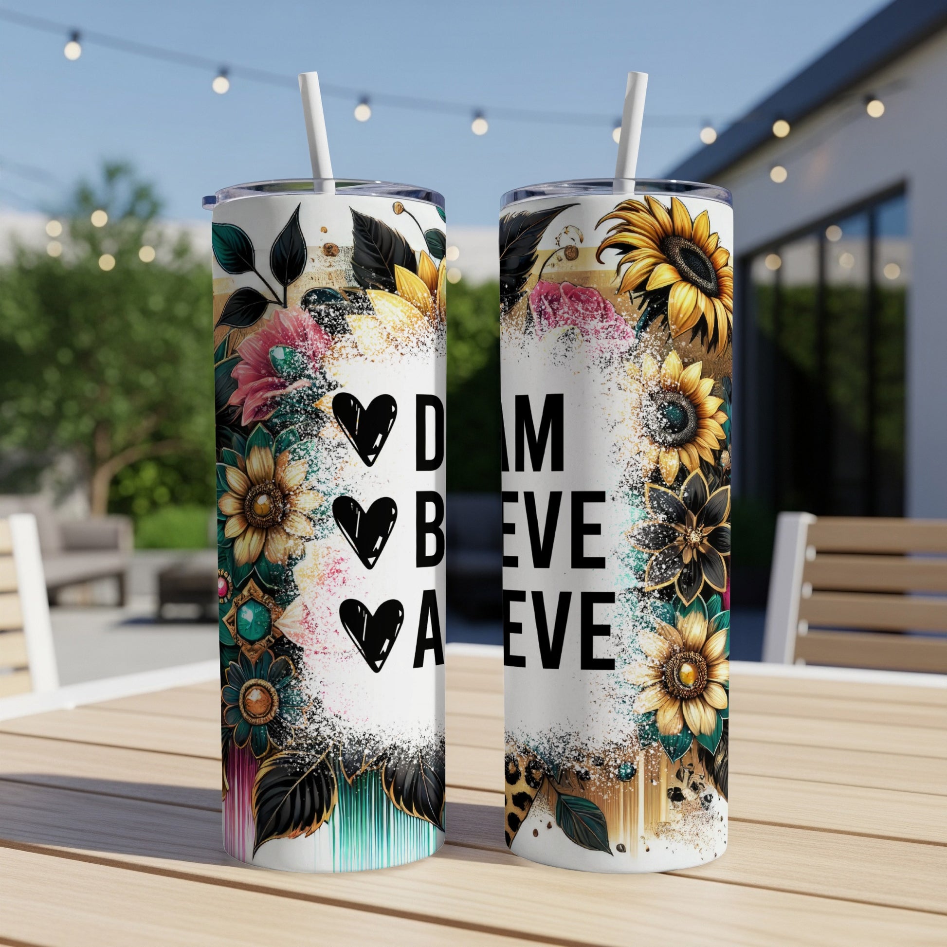 Two tumblers with floral and leopard print designs, featuring the words "Dream Believe Achieve".