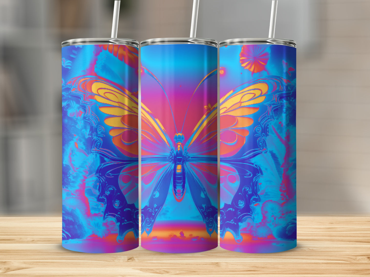 Three tumblers featuring a colorful butterfly design on a wooden surface.