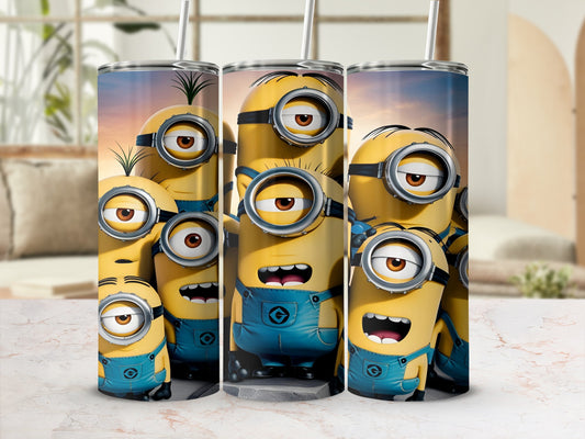 Minions wearing blue overalls on a tumbler with a straw.