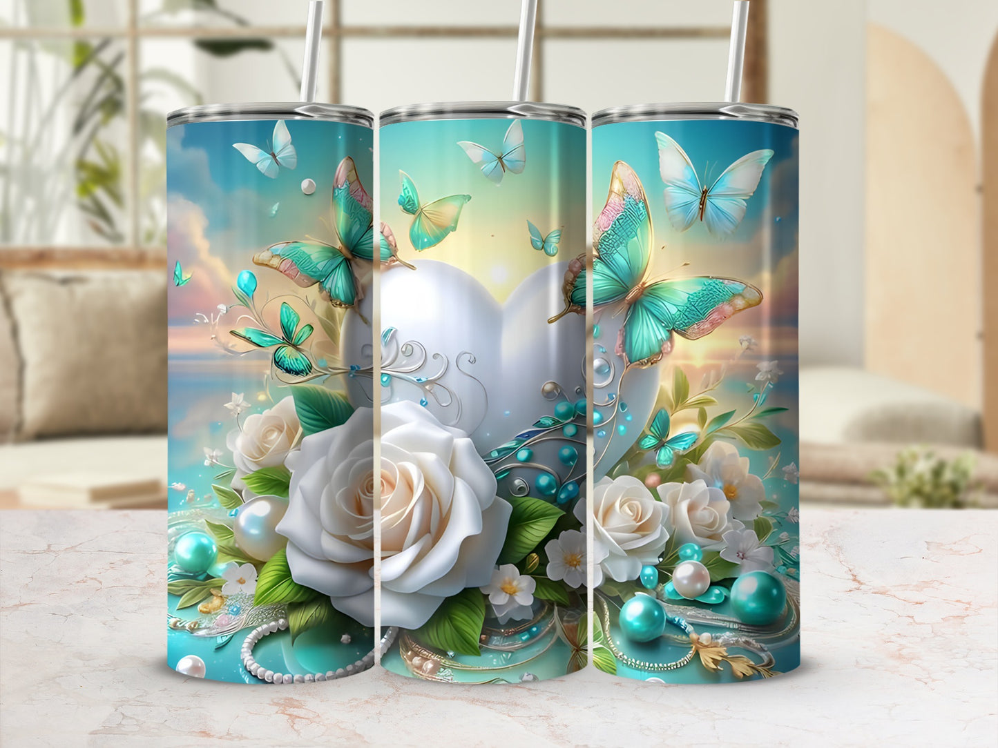 Three tumblers with butterflies, roses, pearls, and floral accents on a light background.