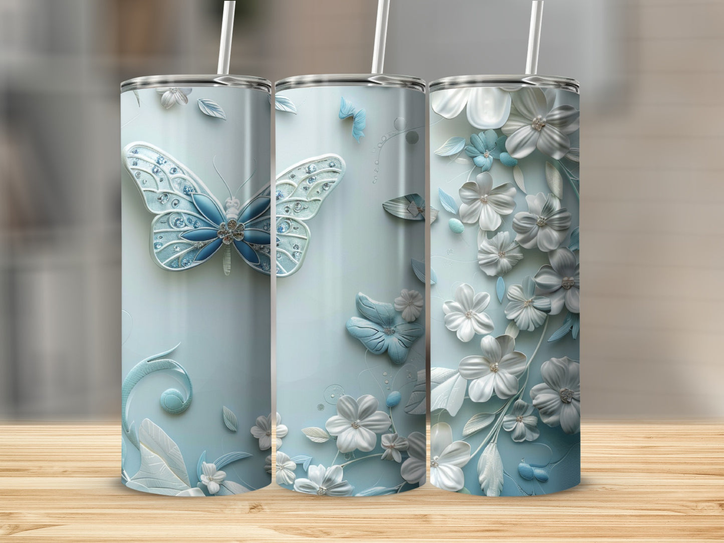 Light blue tumbler with embossed butterflies and floral designs.