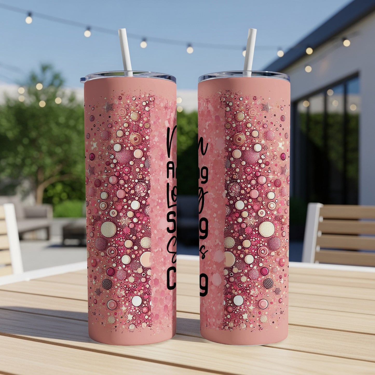 Pink tumbler with intricate speckled pattern and text "Raising Good Humans".
