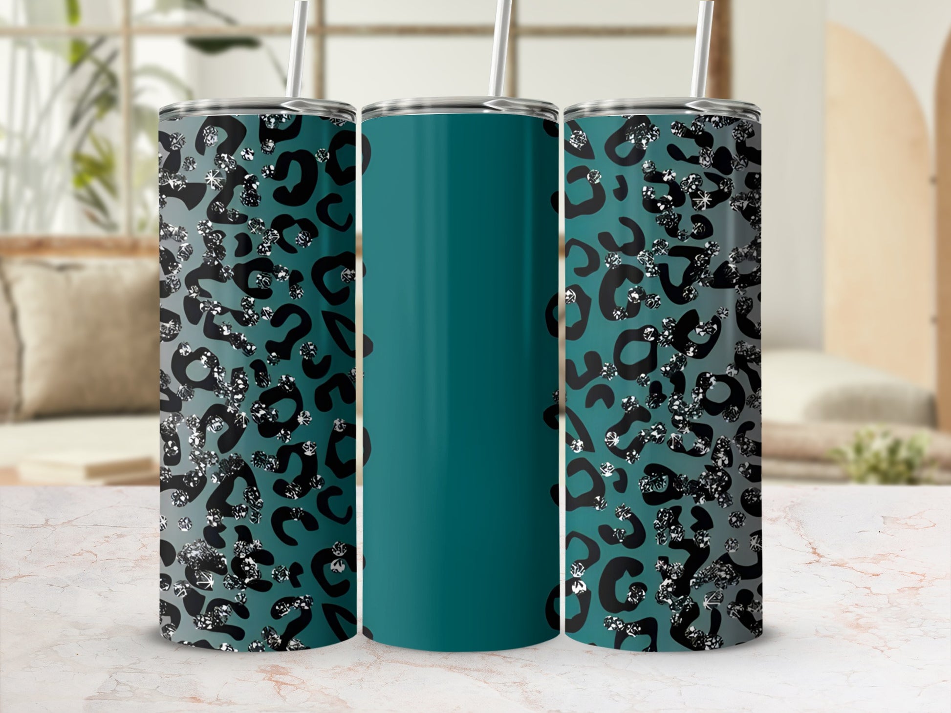 Teal tumbler with black and silver leopard print design.