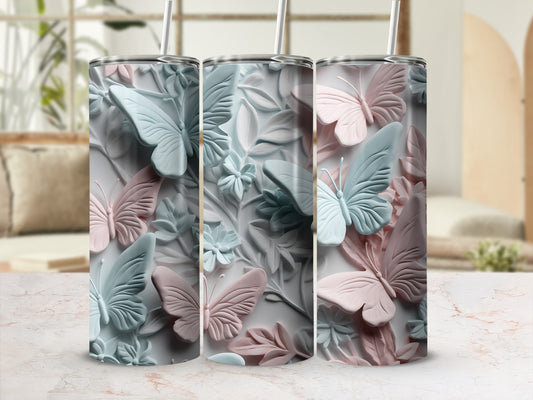 Three tumblers with embossed butterflies and floral designs in pastel colors.
