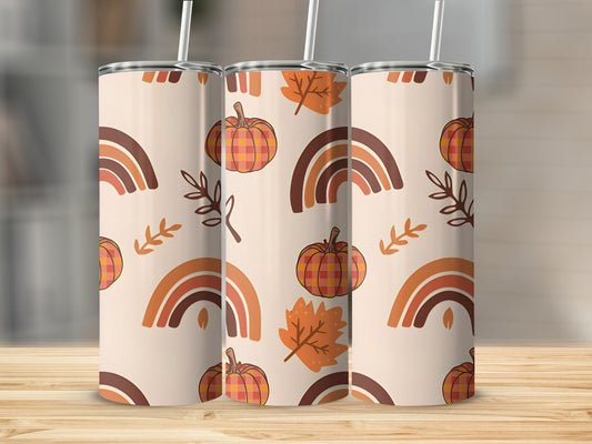 Three tumblers with a fall pattern of pumpkins, leaves, and rainbows.