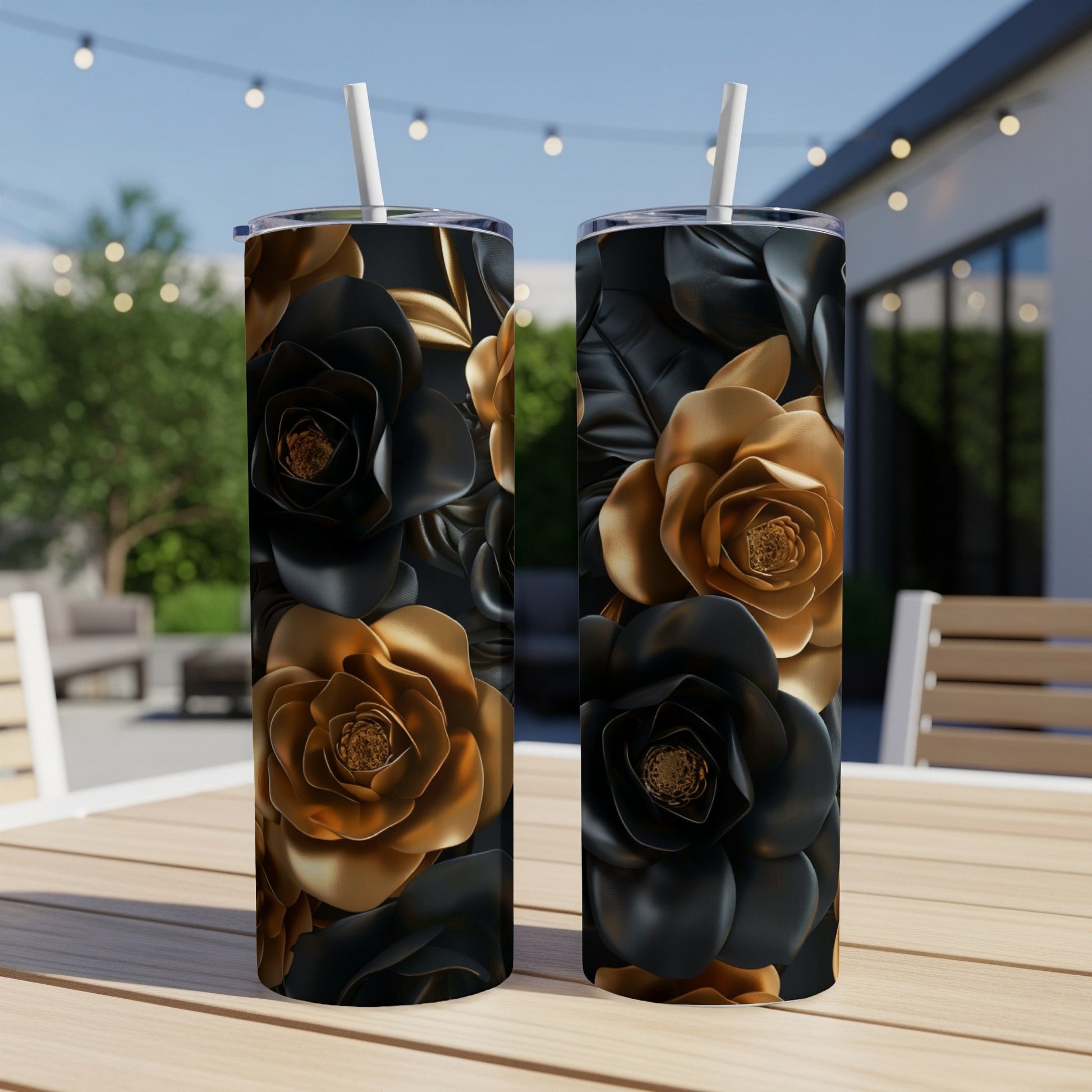 Two tumblers with black and gold floral patterns sit on a wooden table.