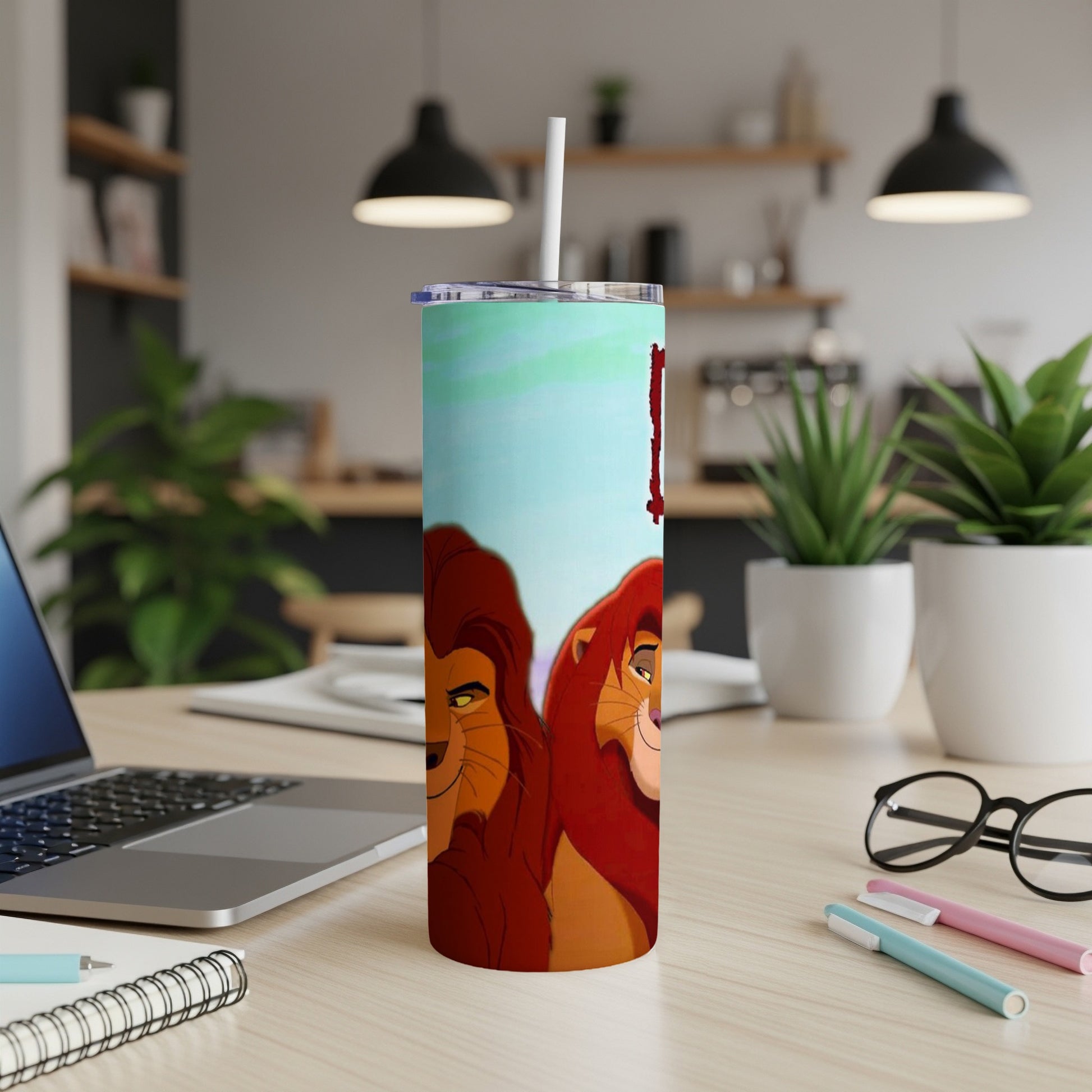 Mufasa and Simba from The Lion King on a blue and green patterned tumbler.