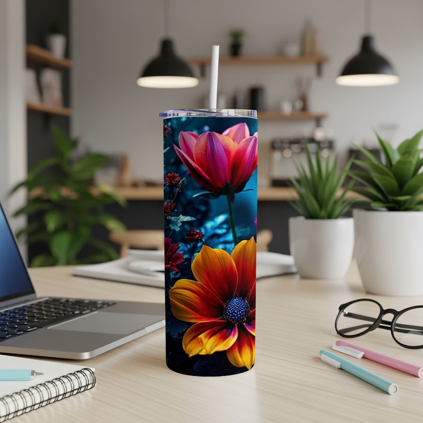 Tall tumbler with a floral design featuring red and yellow flowers.