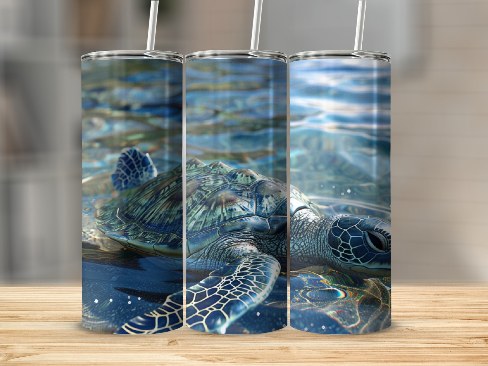 Three tumblers showing a sea turtle swimming underwater.