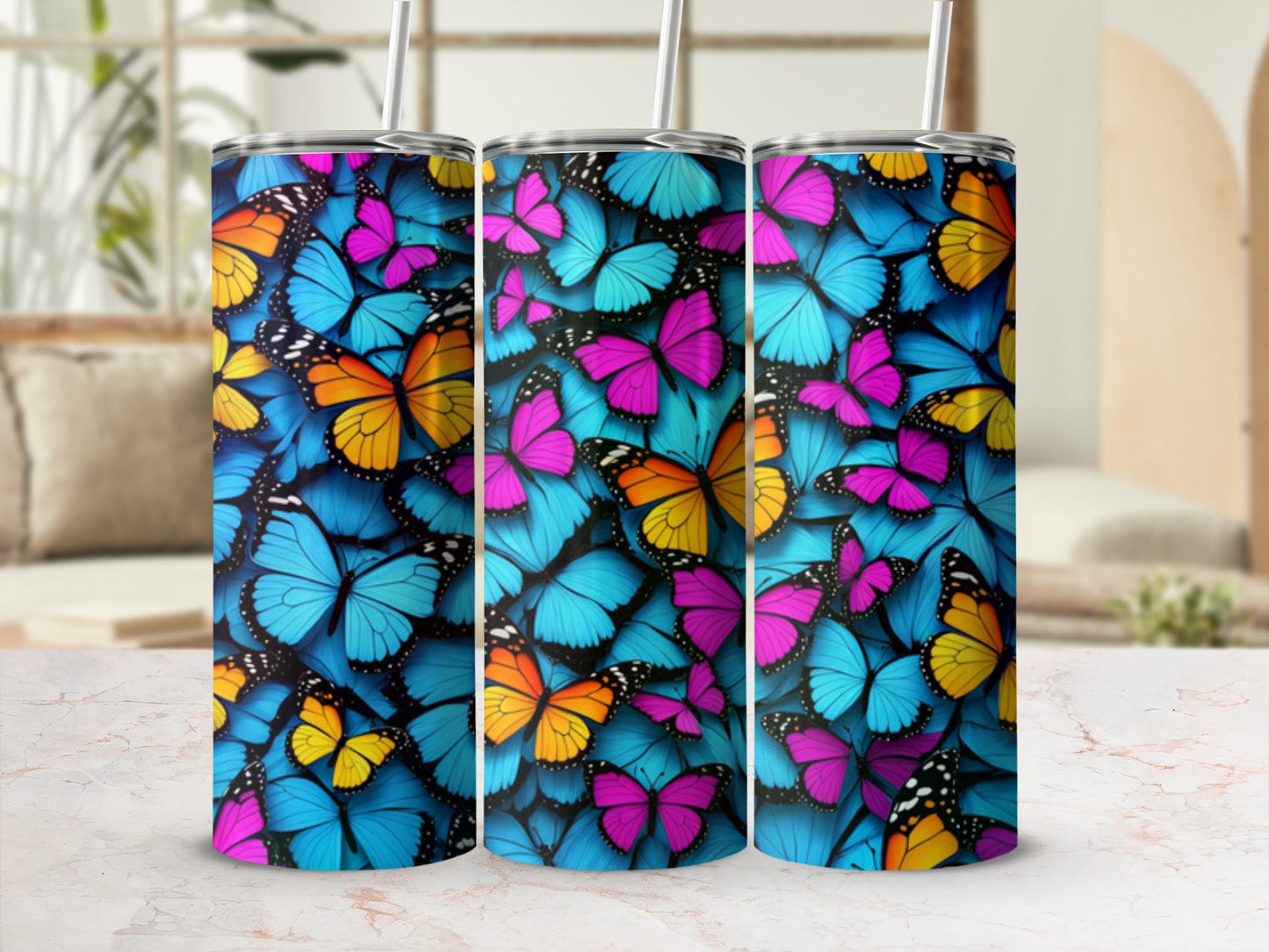 Collage of three tumblers featuring vibrant blue, pink, and orange butterfly patterns.