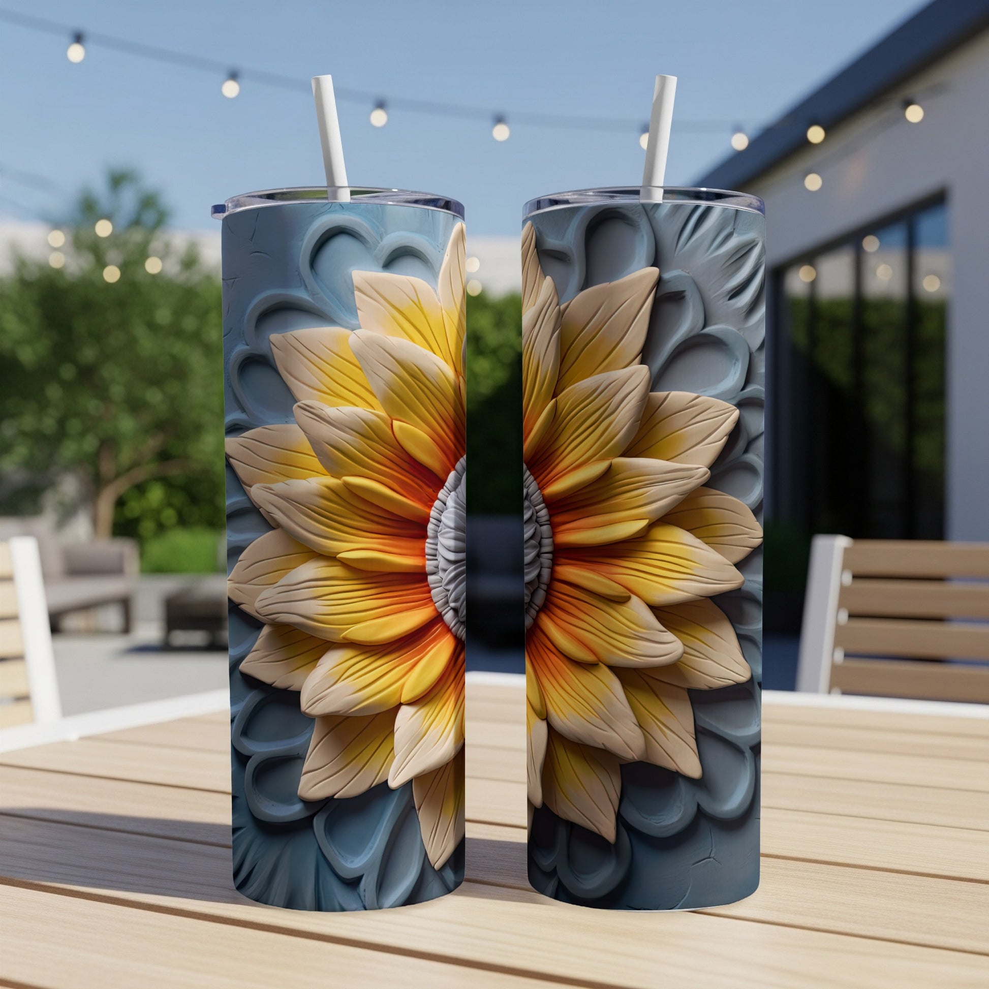 Two tumblers with a textured sunflower design sit on a wooden table.