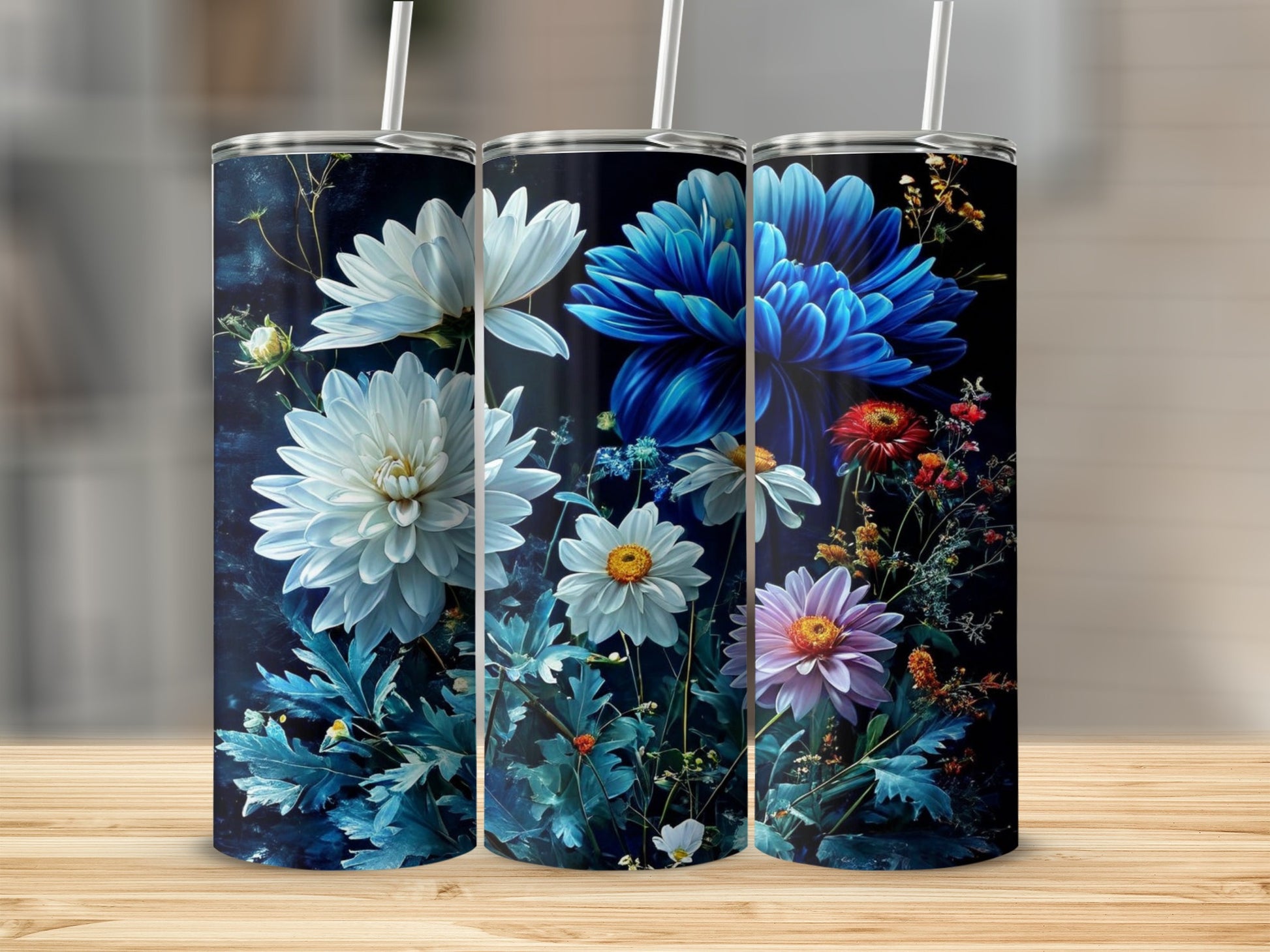 Three floral tumblers with white, blue, and pink flowers on a dark background.