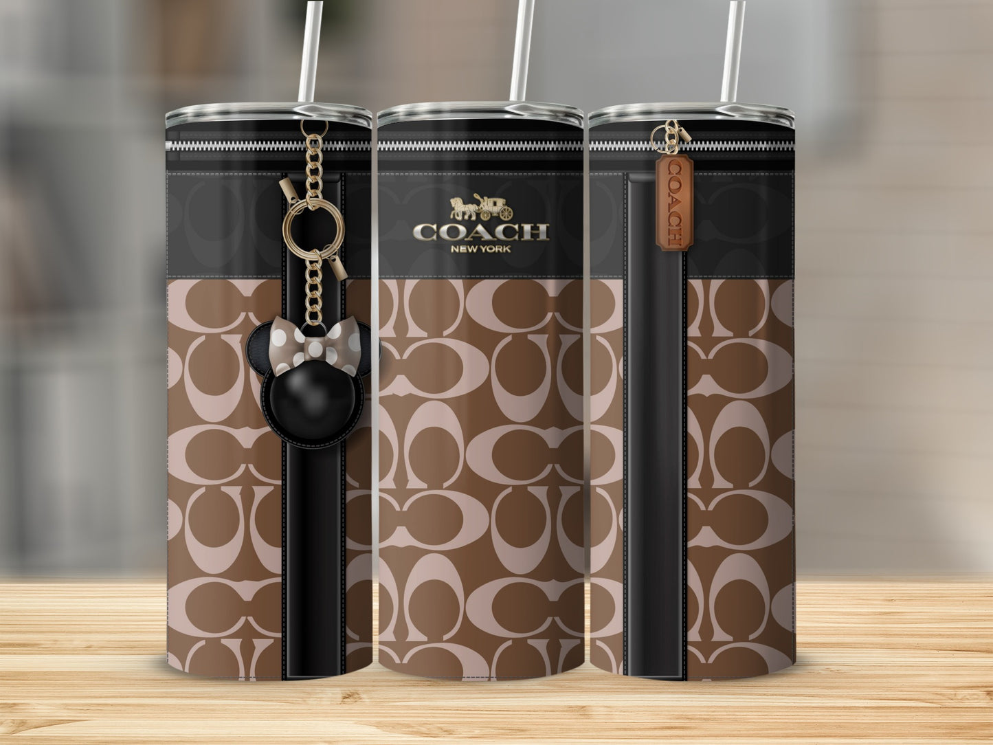 Coach logo tumbler with a brown and beige pattern and Mickey Mouse charm.