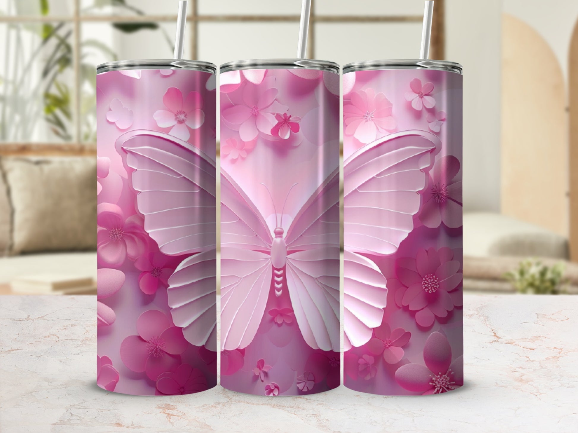 Pink butterfly and floral patterned tumbler with straw.