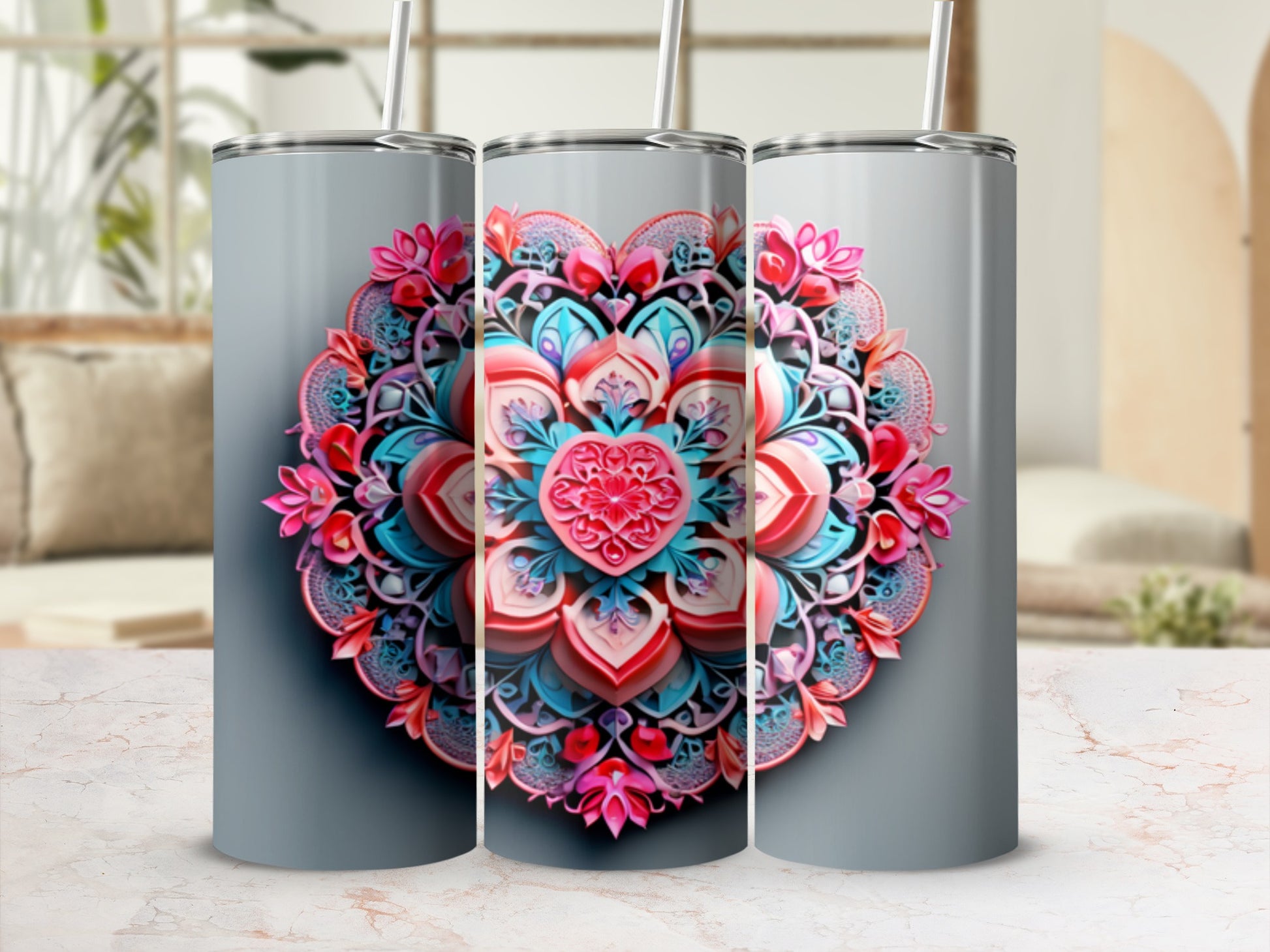 Three tumblers with a pink and blue floral mandala heart design.