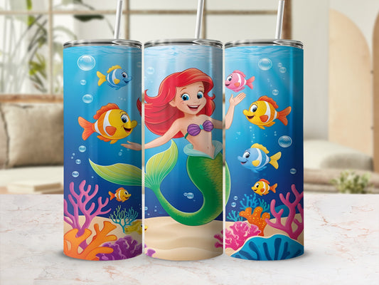 Mermaid with green tail swimming with colorful fish and coral.