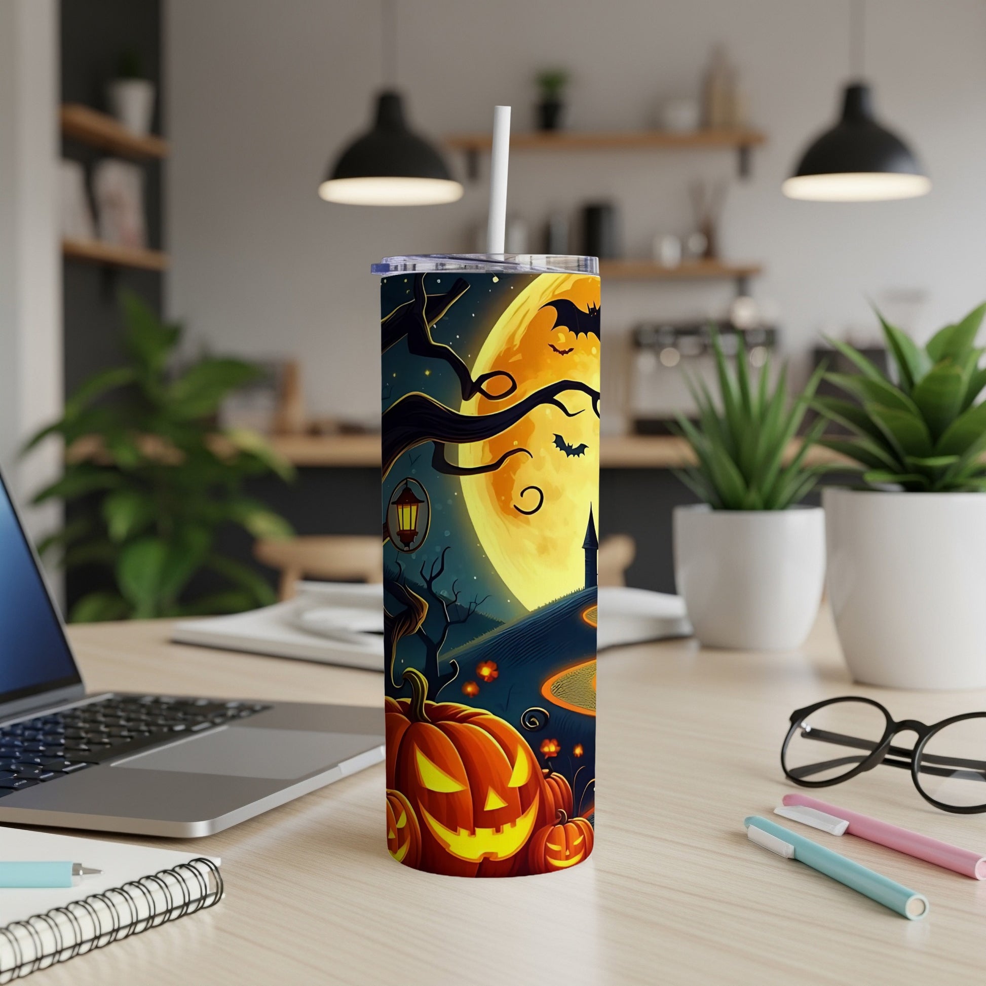 Halloween tumbler with pumpkins, bats, and a full moon.