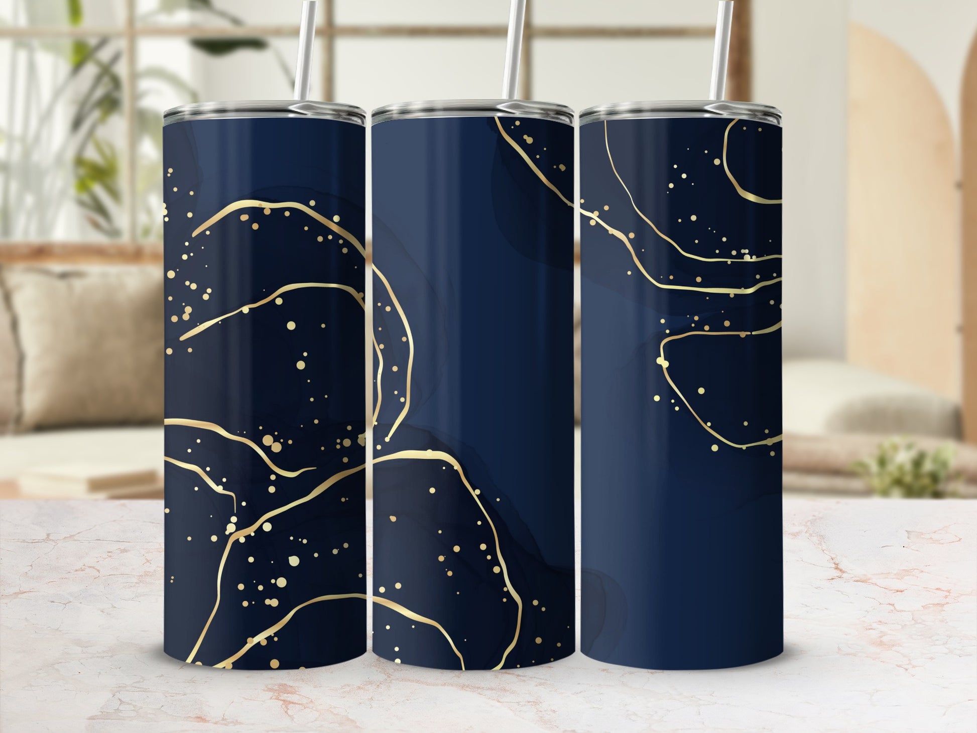 Three navy blue tumblers with gold abstract splatters and lines pattern.