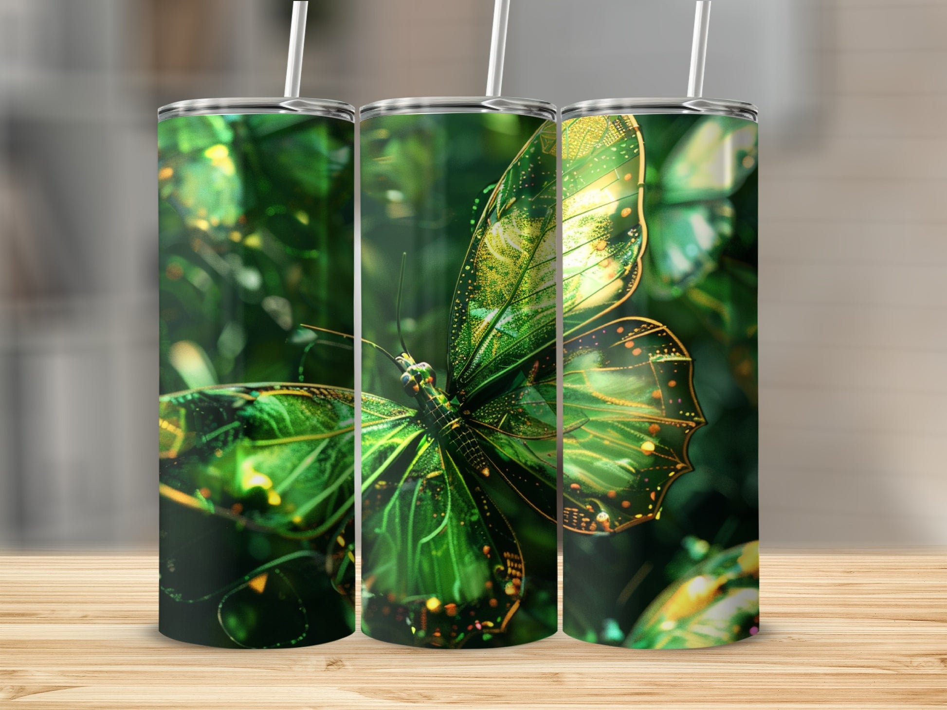Three green iridescent butterfly tumblers with straws on a wooden surface.