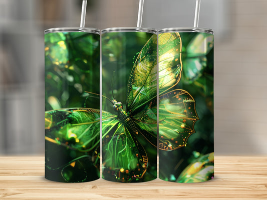Three green iridescent butterfly tumblers with straws on a wooden surface.