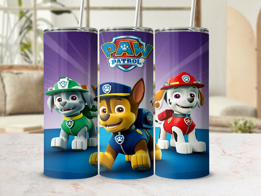 Paw Patrol characters Chase, Marshall, and Rubble on a purple background tumbler.