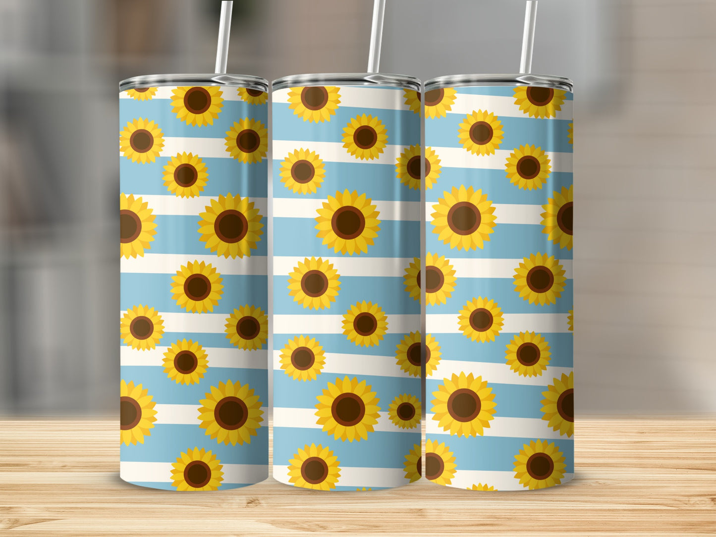 Three tumblers with blue and white stripes and a sunflower pattern.