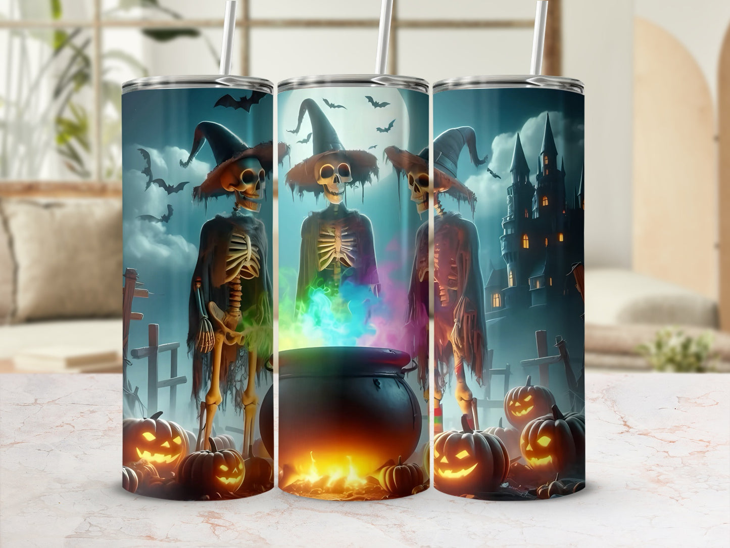 Three Halloween tumblers featuring skeletons, cauldrons, bats, pumpkins, and a castle.