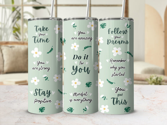 Three tumblers with inspirational quotes and floral designs.