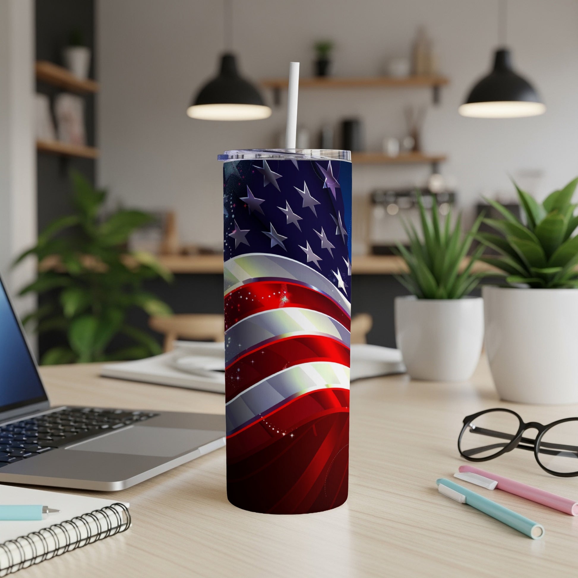 Tall tumbler with American flag design and white straw.