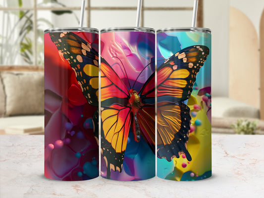 Tumbler with colorful butterfly design and abstract background.