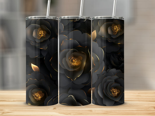 Three black tumblers with golden floral accents displayed on a wooden surface.