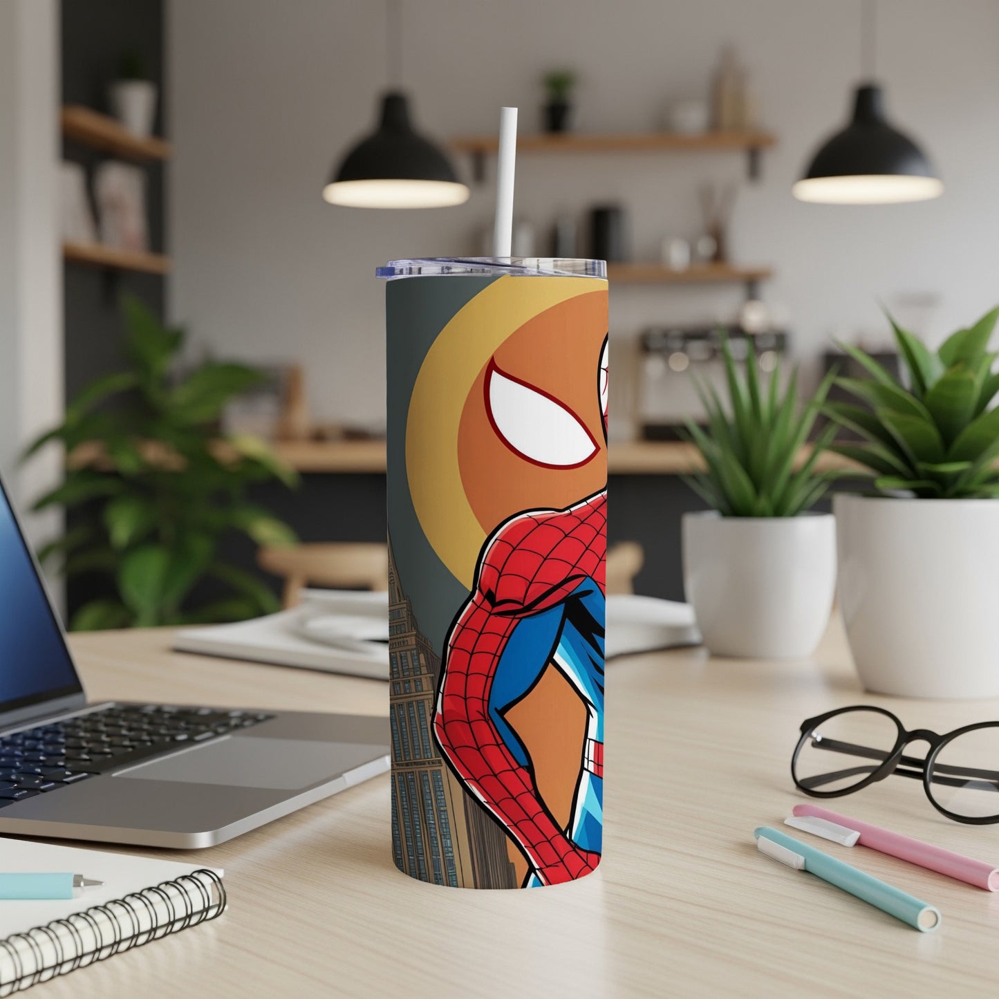Spider-Man on a tumbler with buildings and a sun design.