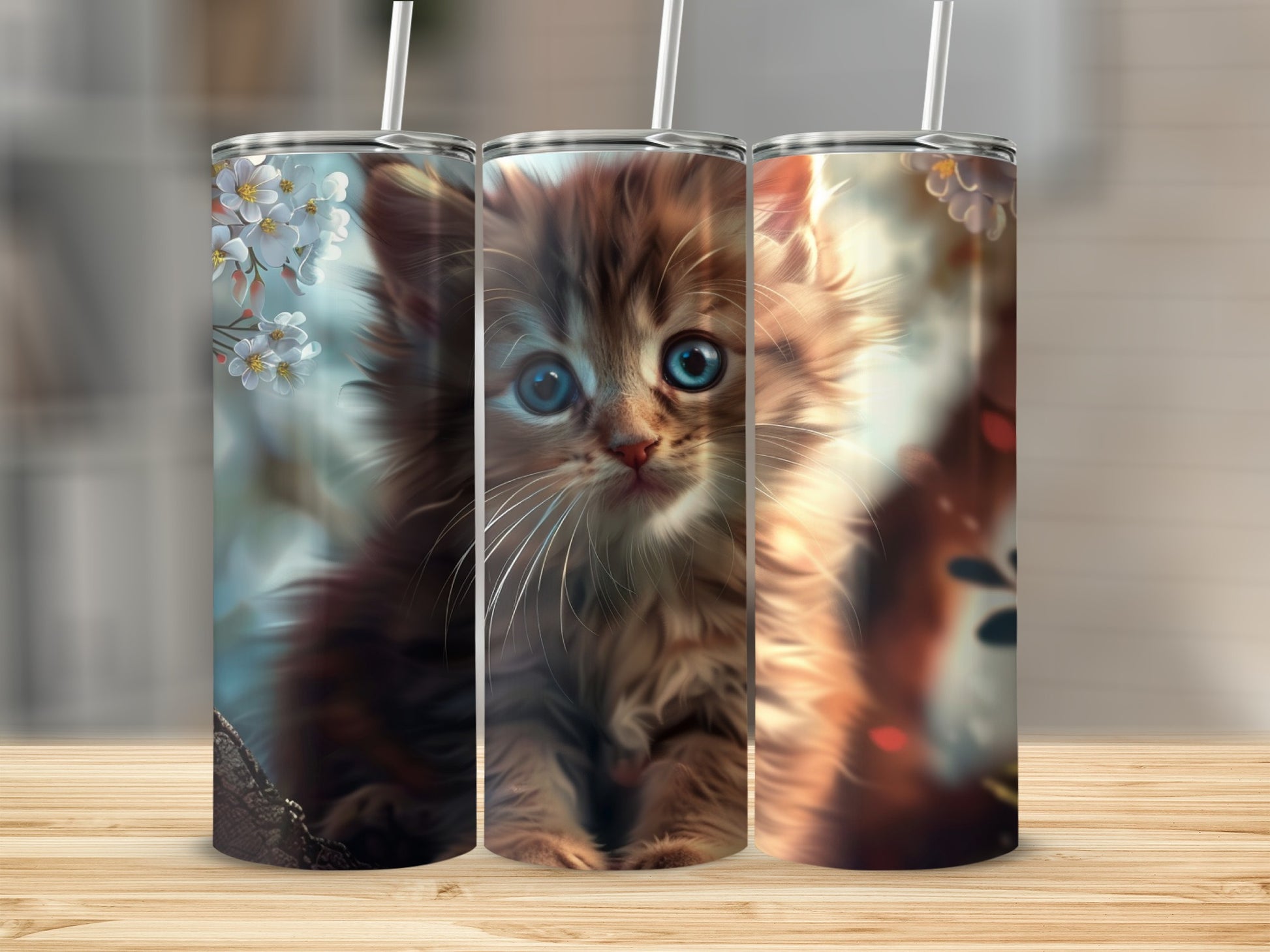 Fluffy kitten with blue eyes on a nature-themed tumbler.
