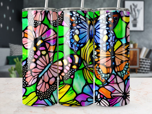 Three stained-glass style tumblers featuring colorful butterflies and floral patterns.