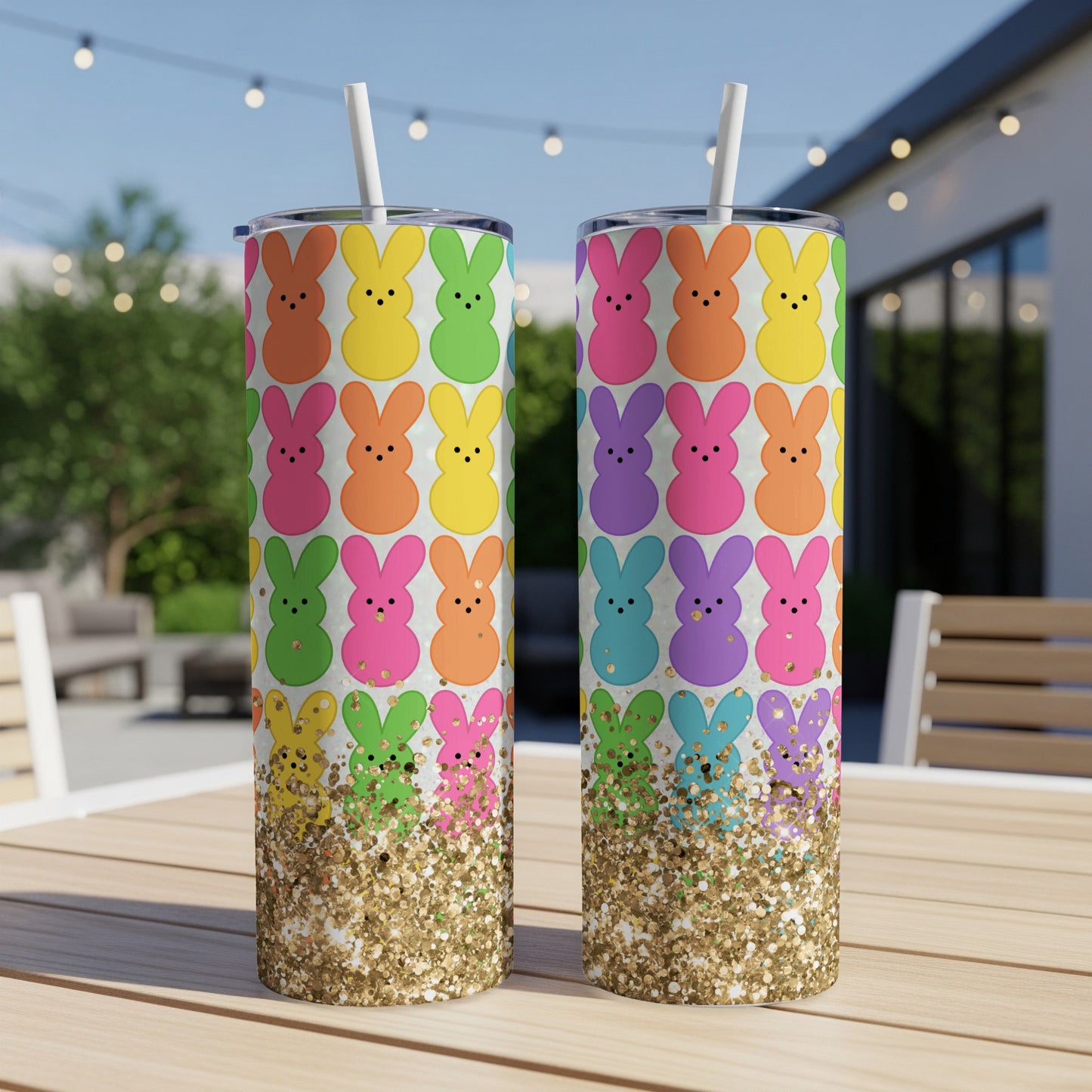 Two colorful Easter bunny patterned tumblers with glitter accents.
