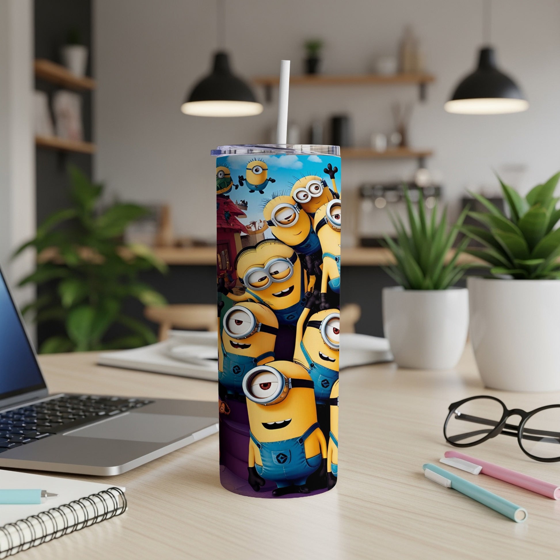 Minions characters on a purple and blue tumbler cup.