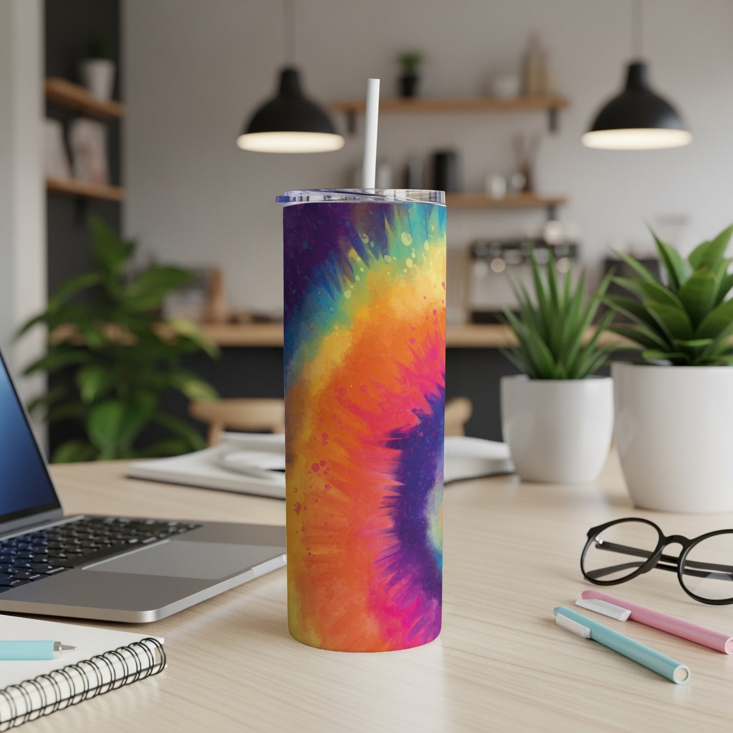 Tall tumbler with vibrant multicolor tie-dye pattern and a white straw.