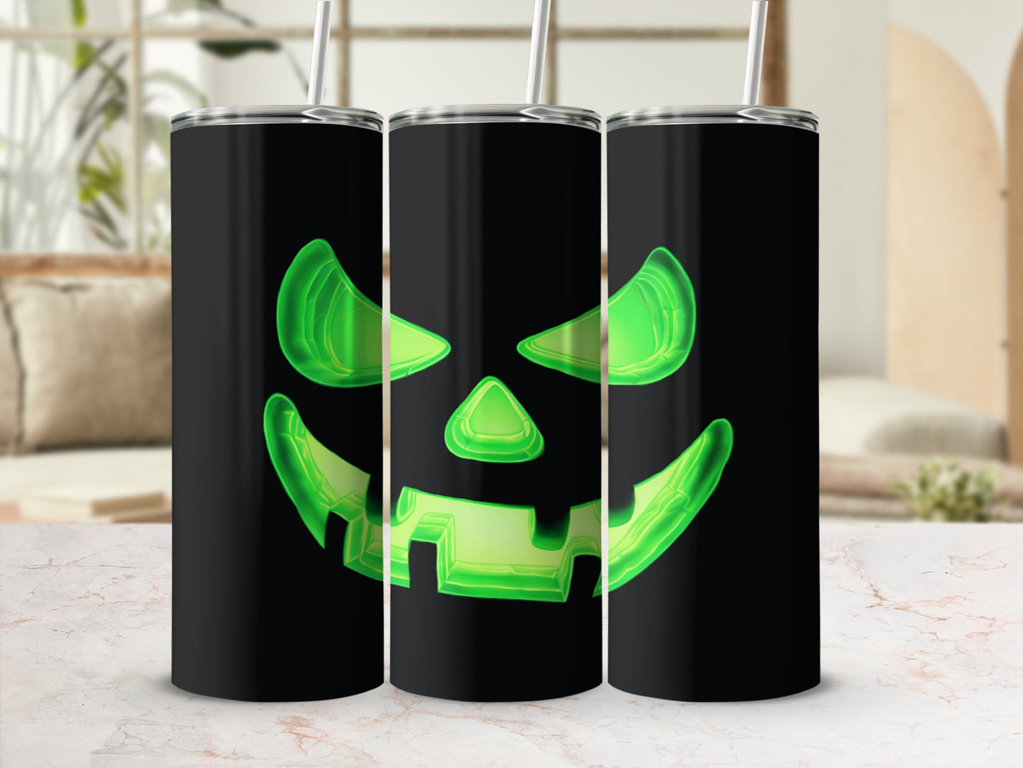 Three black tumblers featuring glowing green jack-o'-lantern faces.
