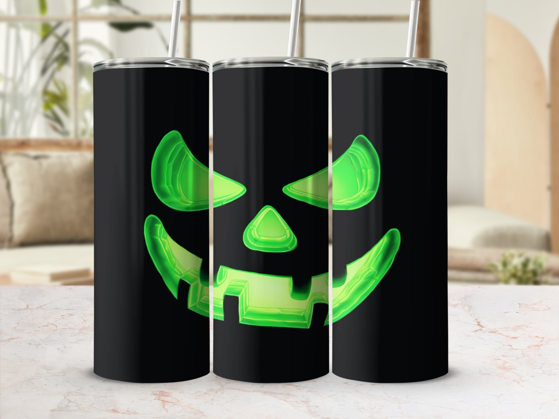 Three black tumblers featuring glowing green jack-o'-lantern faces.