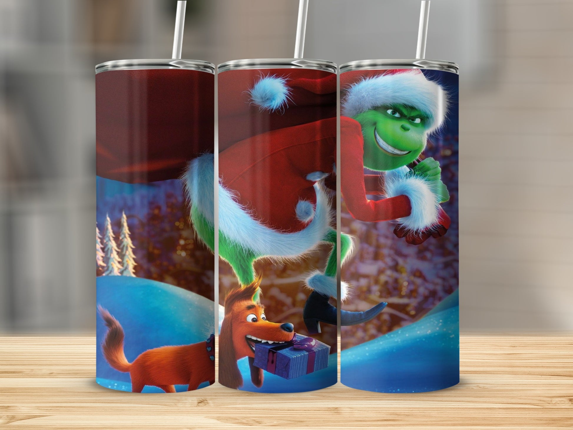 Grinch and Max in Santa hats carrying a gift, with snowy trees.